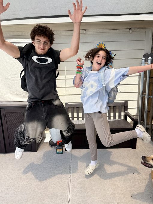 Cade and Colette jumping in the air