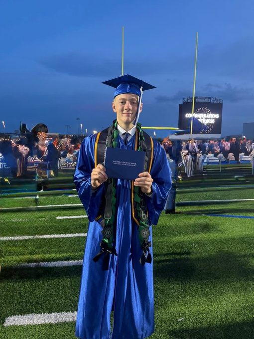 Sebastian in cap and gown at Jarrell High graduation